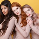 Three young girls with different hair and brow colours.