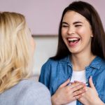 Two smiling women networking on one of Cosmetic Tattoo Clinic's Cosmetic Training Courses.