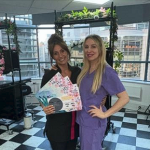 A female student showing off her Cosmetic Makeup certificates with Cara.