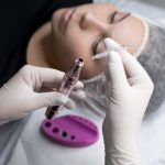 Young woman about to have eyeliner tattoo treatment.